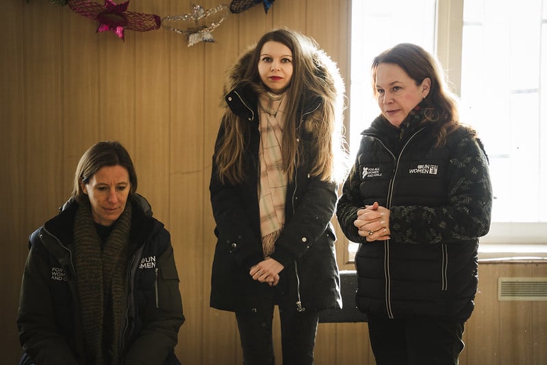 Internally displaced women supported by UN Women gather in a room at a collective site in Kharkiv to take part in a social sewing workshop under a project implemented by UN Women Ukraine in partnership with NGO “Unity Platform” .