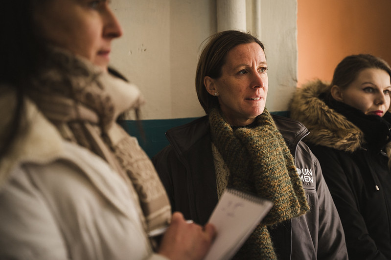 Internally displaced women supported by UN Women gather in a room at a collective site in Kharkiv to take part in a social sewing workshop under a project implemented by UN Women Ukraine in partnership with NGO “Unity Platform” .