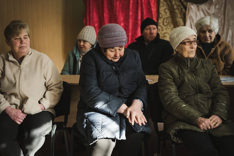 Internally displaced women supported by UN Women gather in a room at a collective site in Kharkiv to take part in a social sewing workshop under a project implemented by UN Women Ukraine in partnership with NGO “Unity Platform” .